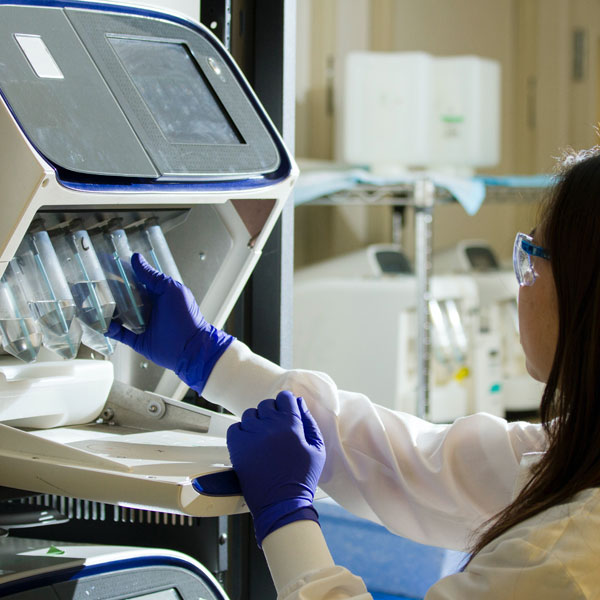 A photo of a female scientist working in a lab