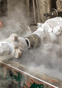 Image of machinery surrounded by carbon dioxide gas