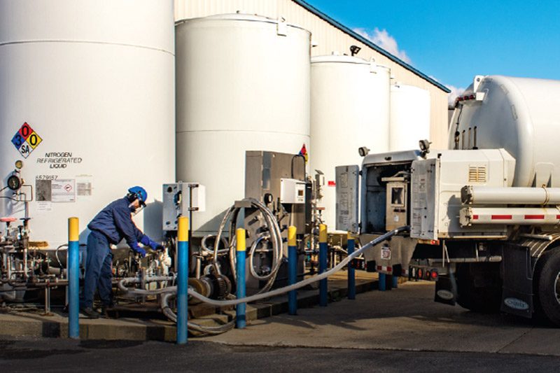 A photo of Middlesex workers filling up their truck with gas