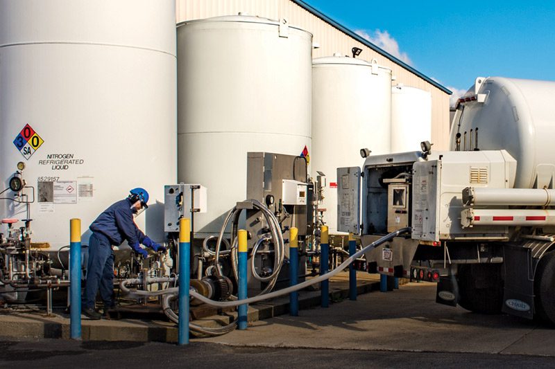 A photo of a Middlesex truck being hooked up to a gas tank