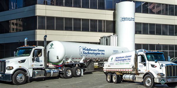 Middlesex trucks in front of the Middlesex building in 2002