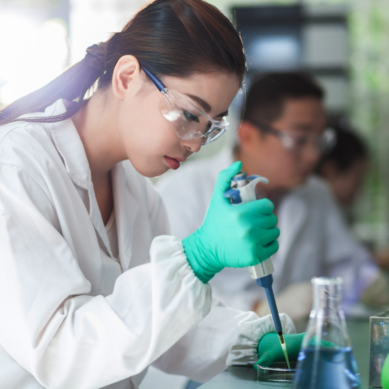 A photo of a female scientist in a lab
