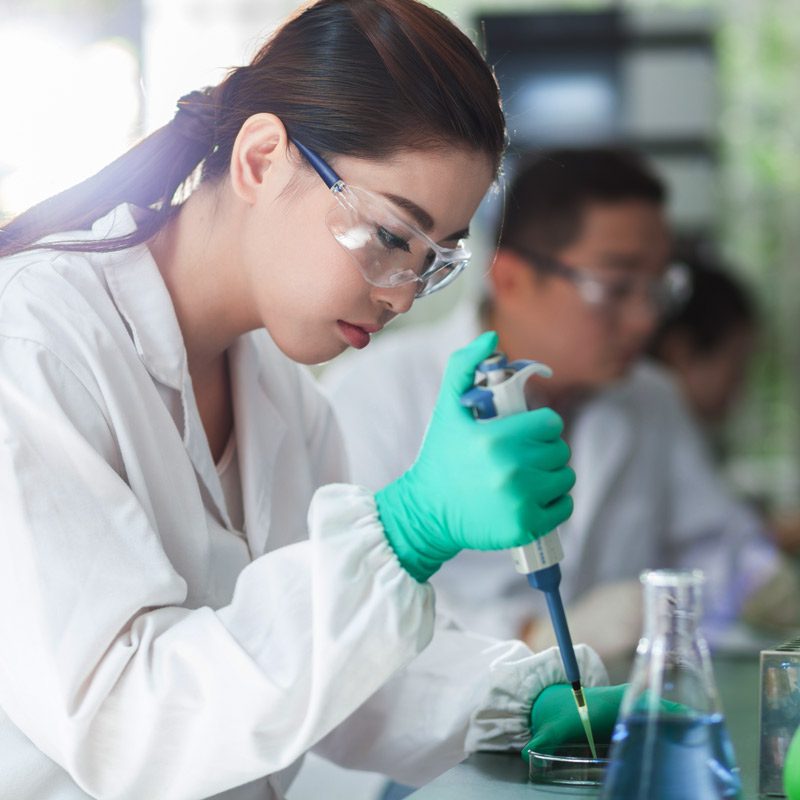 A photo of a female scientist in a lab