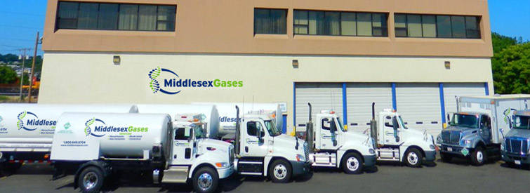 A photo of the Middlesex building and trucks in MA