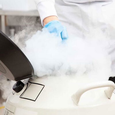 Photo of a person handling gas, used for blog post 'The Value of Monitoring Critical ln2 and CO2 Gases Supplying Cryo-Freezers, Incubators, and Mass Spectrometers.