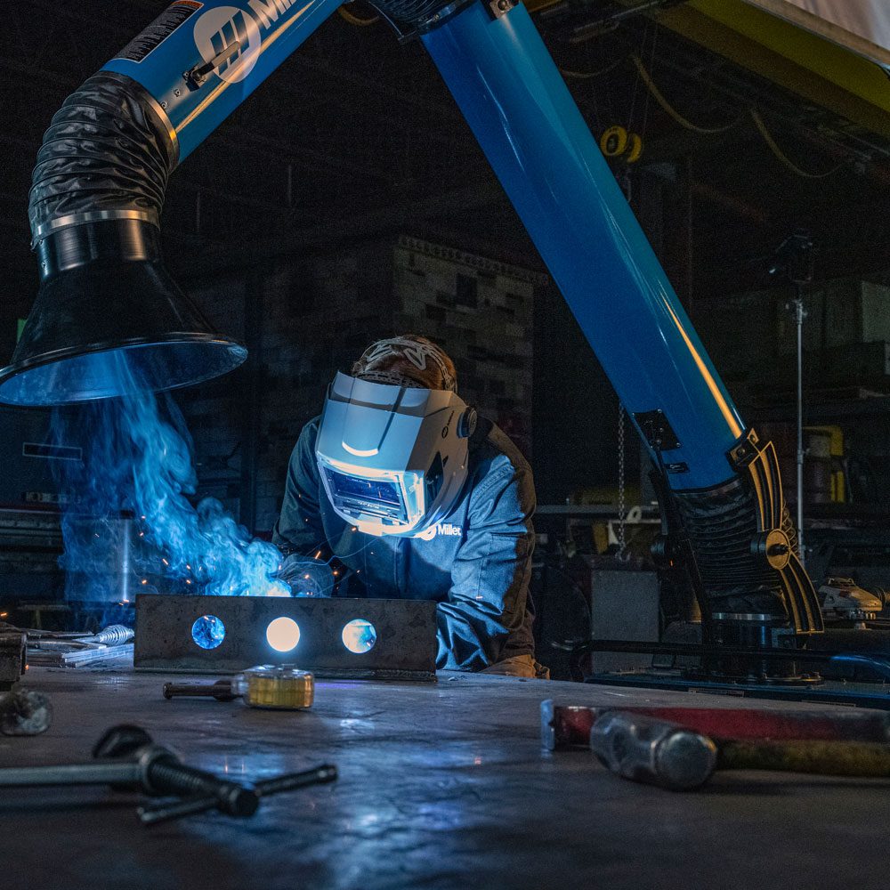 Image of a welder working on a beam