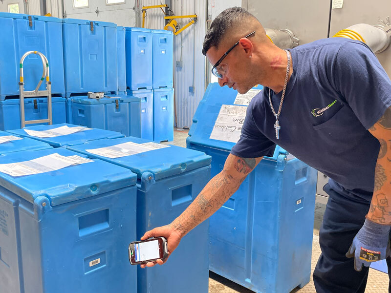 Middlesex Gases employee scanning cylinder inventory with a handheld mobile device